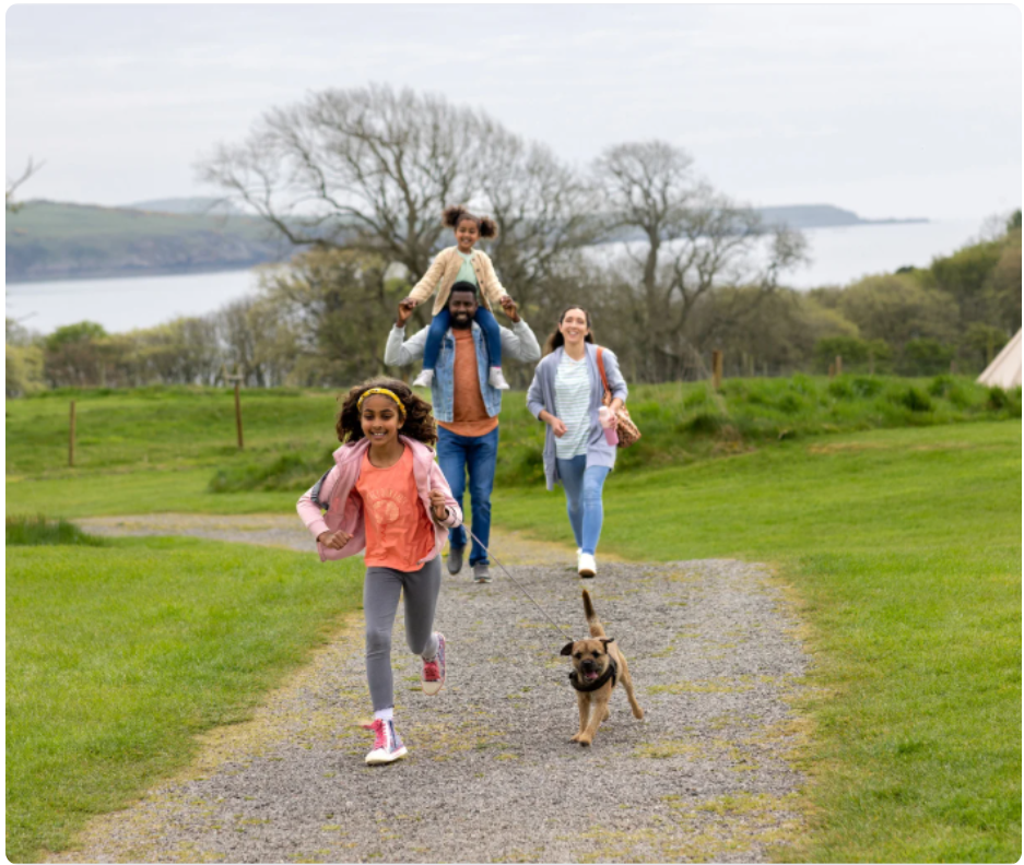 Family walking on nature trails at The Grove mixed-use community in Tega Cay South Carolina